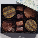 Box of chocolates with a decorative lid on a white background