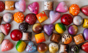 Assorted colorful chocolate candies on a marble surface