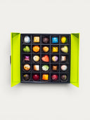 Norman Love Confections 25 piece signature chocolate box with assorted colorful artisan truffles in a green gift box