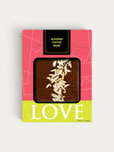 Norman Love Confections Almond Toffee Bark, rich dark chocolate with slivered almonds.