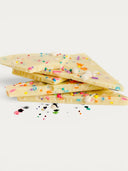 Norman Love Confections Birthday Cake Bar, white chocolate with funfetti sprinkles and white chocolate balls.