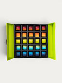 Norman Love Confections 5-layer birthday cake gift box with 20 assorted gourmet chocolates in rainbow colors.
