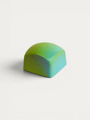 Norman Love Confections Carrot Cake chocolate truffle with green and blue marbled shell.