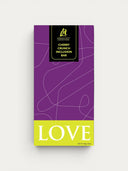 Norman Love Confections Cherry Crunch Inclusion Bar with dark chocolate, dried cherries, and chocolate pearls.