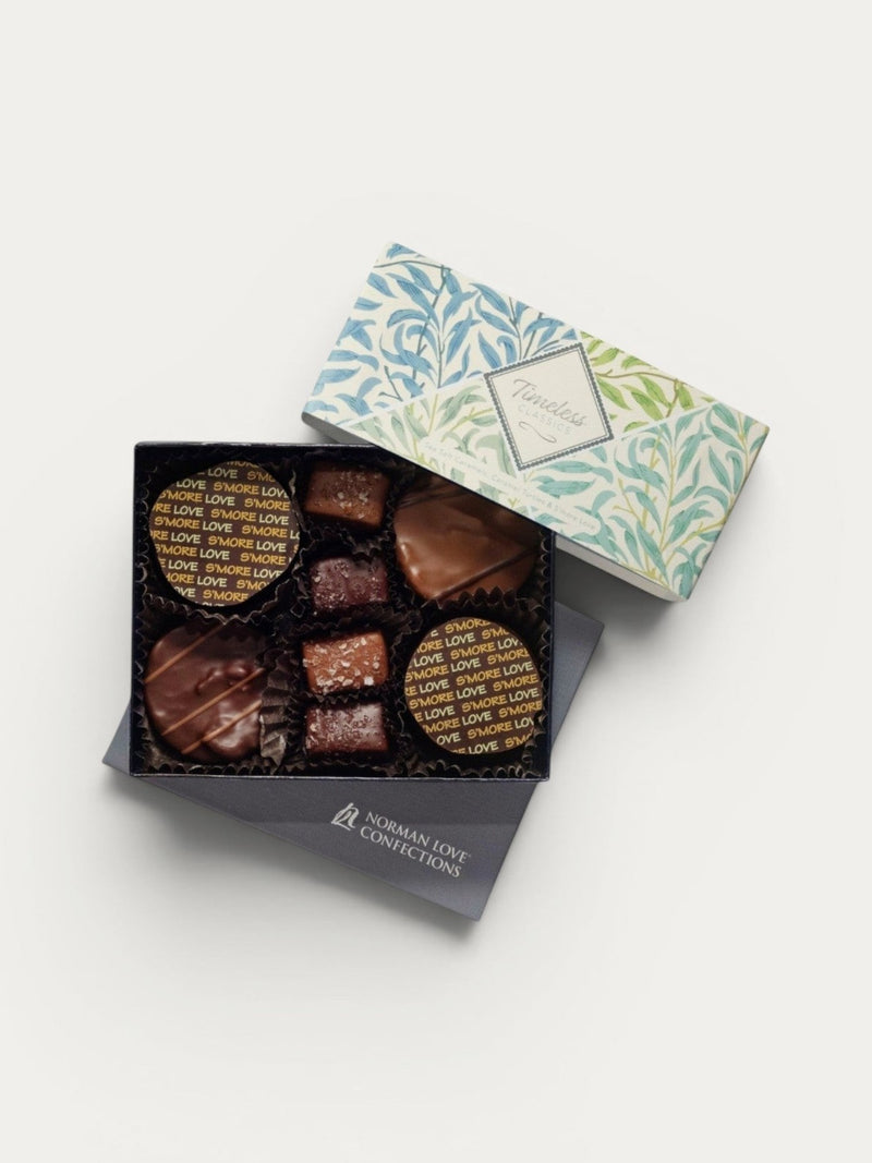 Norman Love Confections assortment box with milk and dark chocolate turtles, sea salt caramels, and S'more Love chocolates.