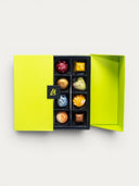 Norman Love Confections 16-piece assorted chocolates in a bright green gift box. Includes Key Lime Pie, Bittersweet Chocolate, and Strawberry flavors.