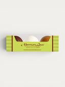 Norman Love Confections chocolate golf balls in milk, white, and dark chocolate flavors.