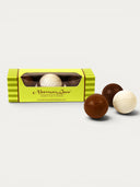 Norman Love Confections milk, white, and dark chocolate golf balls filled with creamy ganache. Gift box.