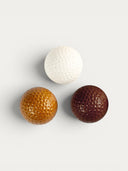 Norman Love Confections chocolate golf balls: white, milk, and dark chocolate with ganache filling.