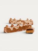 Norman Love Confections Chocolate Hazelnut Bar with swirled milk and dark chocolate layers and a praline base.