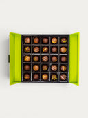 Norman Love Confections chocolate truffles gift box with 20 assorted chocolates in a bright green box.
