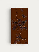 Norman Love Confections Dark Chocolate Cherry Crunch Bar with dried cherries and chocolate pearls.