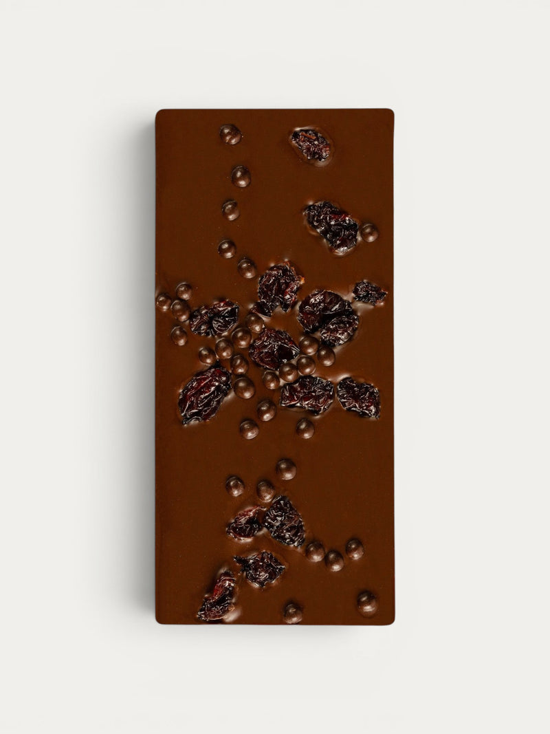 Norman Love Confections Dark Chocolate Cherry Crunch Bar with dried cherries and chocolate pearls.
