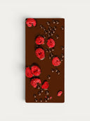 Norman Love Confections Dark Chocolate Raspberry Crunch Bar with freeze-dried raspberries and chocolate pearls.