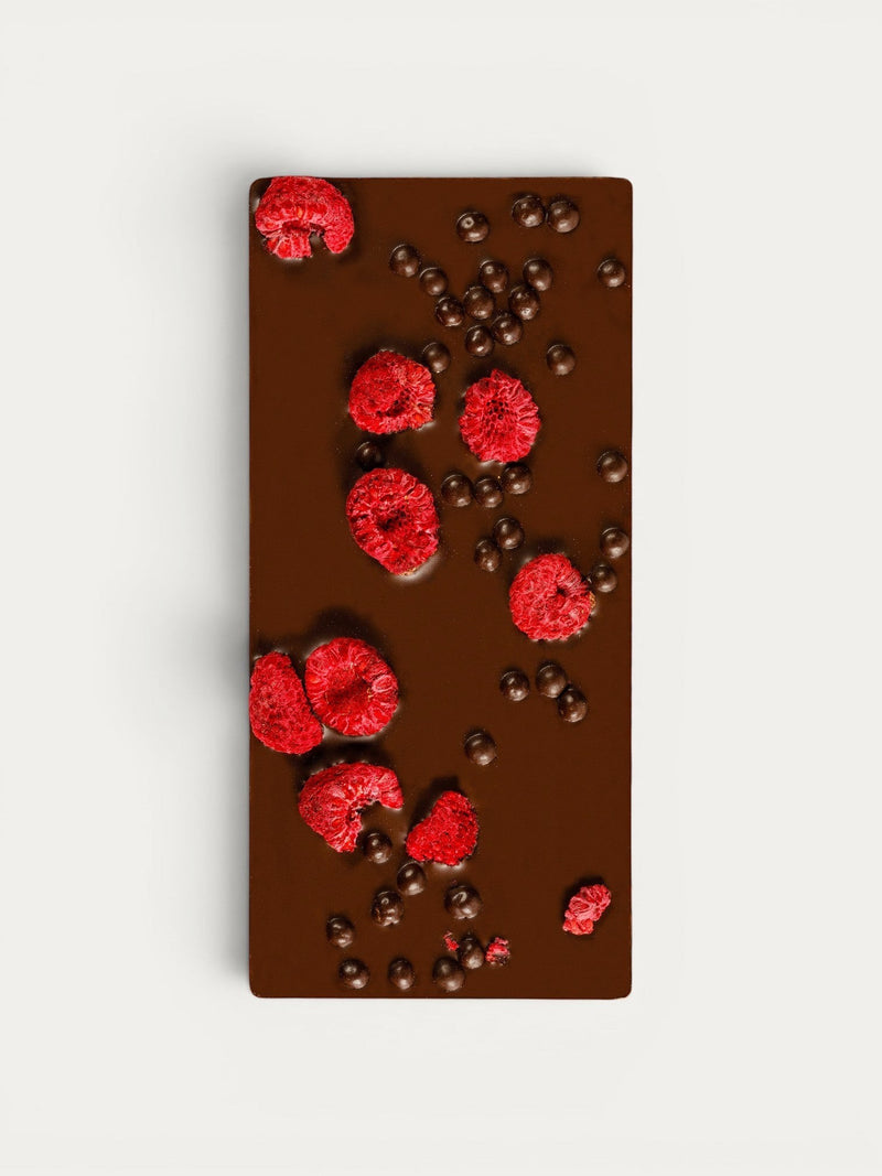 Norman Love Confections Dark Chocolate Raspberry Crunch Bar with freeze-dried raspberries and chocolate pearls.