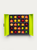 Norman Love Confections Fruit Favorites Gift Box, a bright green box with 25 assorted gourmet chocolates in fruit shapes and colors.