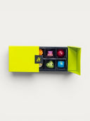 Norman Love Confections bright lime green box with 6 assorted gourmet chocolates, including heart-shaped and square varieties.
