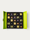 Norman Love Confections 25 piece Halloween chocolate gift box with festive hand-painted designs in a lime green box.