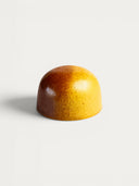 Norman Love Confections Hazelnut Praline chocolate with a smooth praline center and roasted hazelnuts, wrapped in milk chocolate.