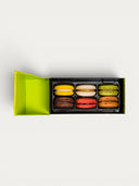 Norman Love Confections 6 piece macaron gift box with Lemon, Pistachio, Dark Chocolate, Raspberry, Caramel, Vanilla flavors.