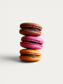 Norman Love Confections 24 piece macaron gift box featuring chocolate, raspberry, and salted caramel flavors.