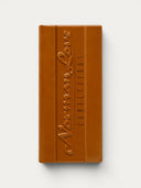 Norman Love Confections solid milk chocolate bar with embossed logo and segmented design.
