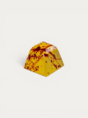 Norman Love Confections PB&J chocolate with yellow shell and red splatters.