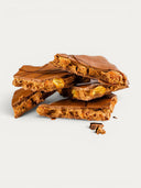 Norman Love Confections Peanut Butter Bark with honey roasted peanuts and peanut butter ganache in milk chocolate.