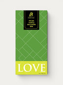 Norman Love Confections Pecan Turtle Inclusion Bar with spiced pecans and milk chocolate.