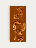 Norman Love Confections Pecan Turtle Bar: milk chocolate bar topped with spiced pecans.