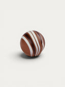 Norman Love Confections Roasted Almond Truffle: milk chocolate truffle with white and dark chocolate swirls and almond center.