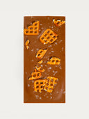 Norman Love Confections Salted Caramel Pretzel Bar with milk chocolate and crunchy pretzel pieces.