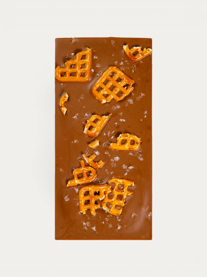 Norman Love Confections Salted Caramel Pretzel Bar with milk chocolate and crunchy pretzel pieces.