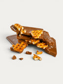 Norman Love Confections Salted Caramel Pretzel Bar, milk chocolate bark with salted pretzel pieces and caramel.