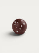 Norman Love Confections Sea Salt Caramel Truffle, dark chocolate with caramel filling and sea salt flakes.