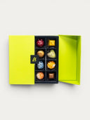 Norman Love Confections custom 32 piece signature box with assorted gourmet chocolates in a bright yellow box.