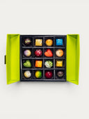 Norman Love Confections 25 Piece Signature Gift Box filled with assorted gourmet chocolates in various shapes and vibrant colors.
