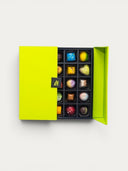 Norman Love Confections 25 Piece Signature Gift Box featuring assorted gourmet chocolates in a bright green box.