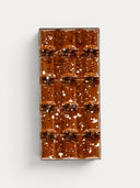 Norman Love Confections Vanilla Caramel Bar, a rich brown chocolate bar with a speckled white design.
