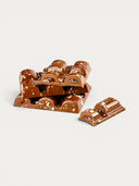 Norman Love Confections Vanilla Caramel Bar, milk chocolate with white speckles and caramel filling.