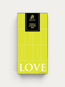Norman Love Confections Vanilla Caramel Bar packaging with lime green background and white grid pattern.