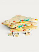 Norman Love Confections white chocolate bar with fruity cereal pieces and pop rocks.