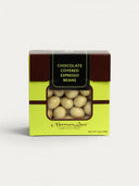 Norman Love Confections white chocolate covered espresso beans in a lime green box with a window.