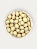 Norman Love Confections white chocolate covered espresso beans in a bowl.