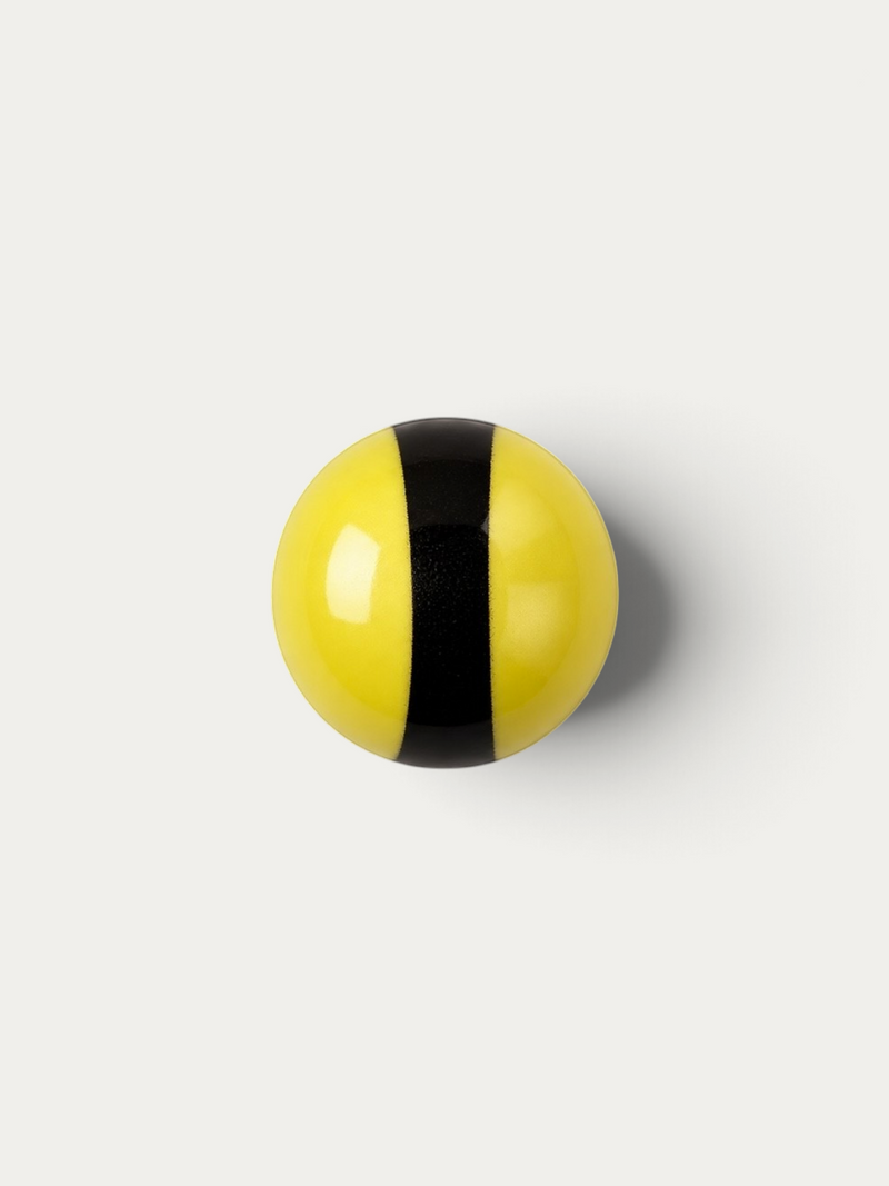 Norman Love Confections round marshmallow coated in smooth yellow and black striped milk chocolate